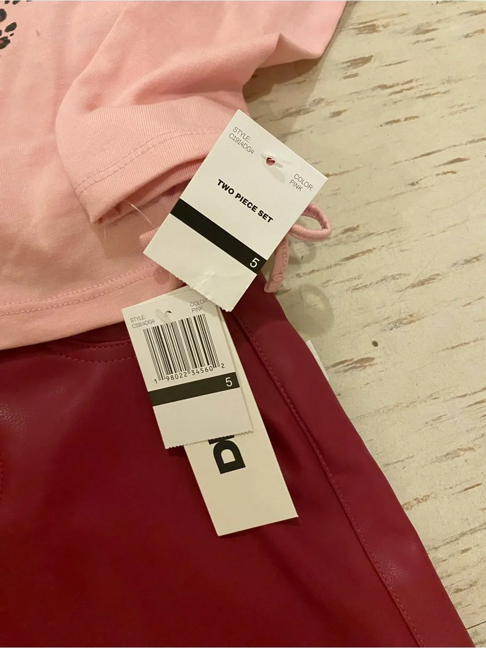 DKNY Pink Long-Sleeve Tee with Leopard Butterfly Print and leather skirt